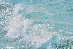 Closeup sea wave splash, crystal clear blue ocean wave, blue water in pastel colors