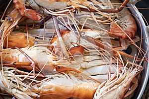 Closeup Seafood platter lunch in Thailand Summer vacation overhead shot. Cooked  crab prawns on ice and wooden background. Tasty