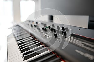 Closeup selective focus on keyboard of new electric synthesizer at shop showcase