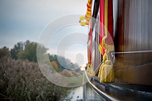 Closeup selective focus shot of golden tassels hanging over a boat in Elburg, Netherlands