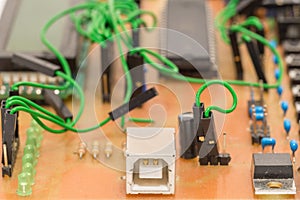 Closeup of a self-made printed circuit board with microcontroller