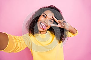 Closeup self portrait pretty careless inspired nice optimistic glad teen teenager lady taking selfie showing tongue and