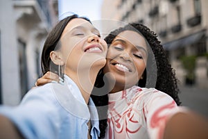 Closeup Selfie Of Two Beautiful Multiethnic Female Friends Posing Outdoors