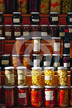 Closeup of selling homemade pickles olive and oil herbs in market