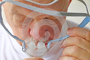 Closeup senior with CPAP equipment