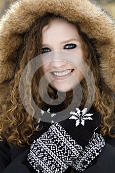 Closeup senior portrait of teenage girl in winter hood