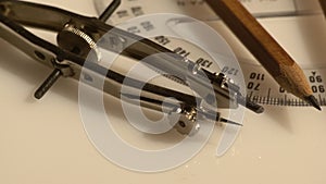 Closeup of a set of compasses and a pencil