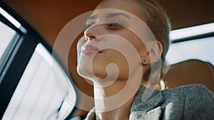 Closeup sexy business woman relaxing at car. Beautiful girl dancing at backseat