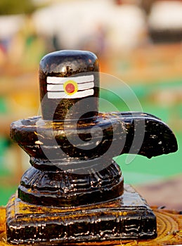 Closeup of Shiv linga,carved stone statue,the symbol of Hindu god Shiva photo