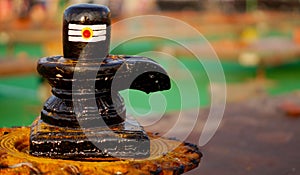 Closeup of Shiv linga,carved stone statue,the symbol of Hindu god Shiva photo