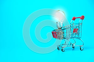 Closeup shopping cart and light bulb for e-commerce or shopping concept on white background