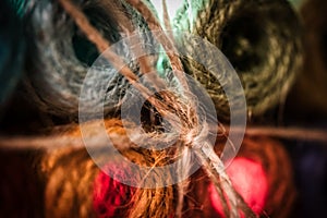 Closeup shot of abaca yarns with the reflection of red light