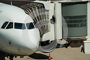 Closeup shot of an airplane with the portable stairway captured in an airport