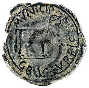 Closeup shot of an ancient Roman coin with emperor Severus inscription