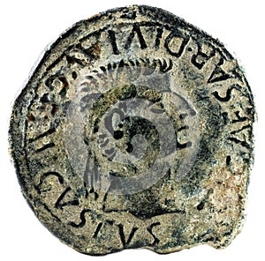 Closeup shot of an ancient Roman coin with emperor Tiberius inscription