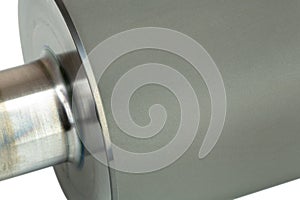 Closeup shot of an anilox roller also called a raster cylinder or ceramic coated roller, isolated on white background.