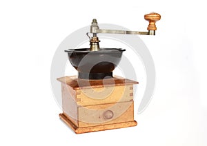 Closeup shot of an antique coffee grinder on a white background