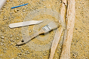 Closeup shot of archaeology tools on the floor