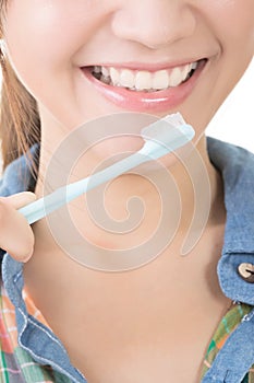 Closeup shot of asian woman brushing teeth