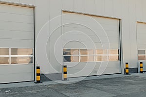 A closeup shot of automatic metal roller door used in factory, storage, garage, and industrial warehouse. The corrugated and
