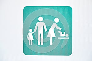 Closeup shot of a baby changing room sign icon on the wall