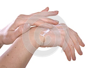 Closeup shot of beautiful female hands  applying moisturiser