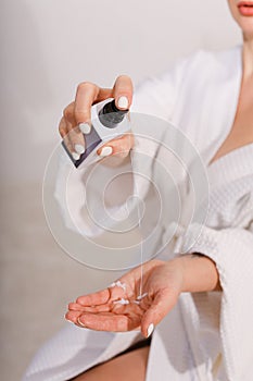 Closeup shot of beautiful female hands applying moisturiser. Beauty woman& x27;s hand applying cream