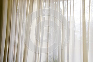 Closeup shot of a beautiful limpid beige curtain - interior photo