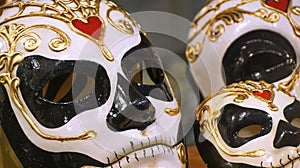 Closeup shot of beautiful Venetian carnival masks with golden and red elements
