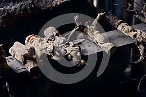 Closeup shot of beautiful wood art with faces in Orosi, Costa Rica photo