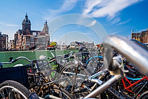 Closeup shot of bicycles on the background of the Basilica of Saint Nicholas Amsterdam