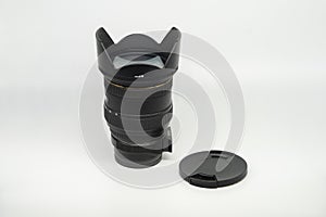 Closeup shot of the black camera lens on a white background