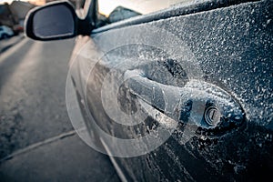 Closeup shot of a black frozen car