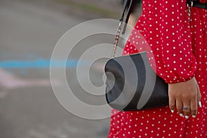 Closeup shot of black leather purse. Space for text