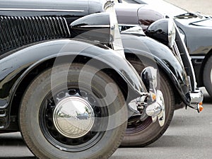 Closeup shot of black old style vintage cars