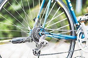 Closeup shot of blue bicycle gears with a blurred background