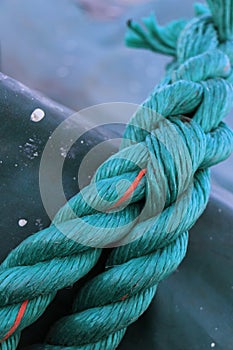 A closeup shot of a blue rope on a ship