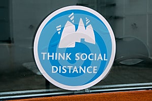 Closeup shot of a blue sticker about social distance in Euston railway station, Wembley, UK