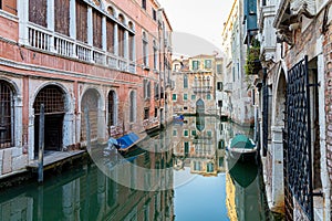 Closeup shot of boats in the Grand Canal and colorful buildings in Venice, Italy
