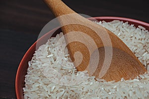 Closeup shot of a bowl of rice on a wooden surface