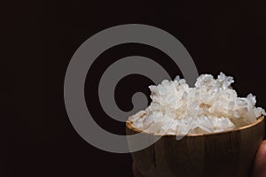 Closeup shot of a bowl of rice on a wooden surface