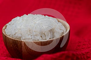 Closeup shot of a bowl of rice on a wooden surface