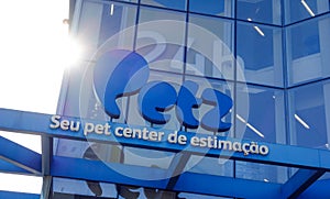 Closeup shot of the Brazilian pet company Petz brand logo on the facade of the building