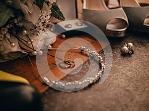 Closeup shot of a bridal accessorize and marriage rings