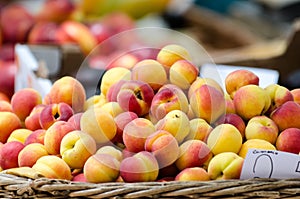 Closeup shot of a bunch of peaches in a market