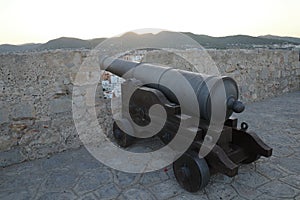 Closeup shot of a cannon in a fort