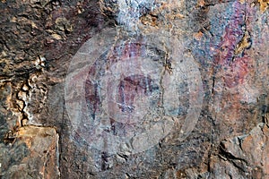 Closeup shot of cave paintings in a Cueva Chiquita cave in the Natural Park of the Villuercas