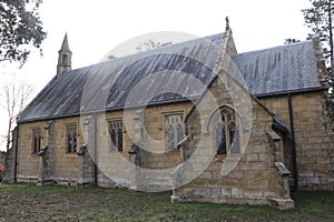 Closeup shot of a chapel surrounded by autumn trees