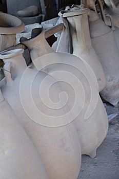 Closeup shot of clay pitchers of different sizes