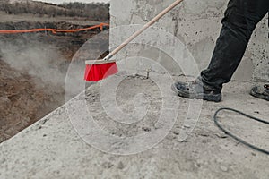 Closeup shot of a cleaning brush being used at the construction